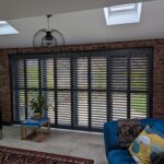 Anthracite Tracked Shutters Over Bi Folds in Chester