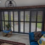 Anthracite Tracked Shutters Over Bi Folds in Chester