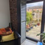 Anthracite Tracked Shutters Over Bi Folds in Chester