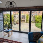 Anthracite Tracked Shutters Over Bi Folds in Chester