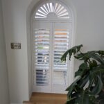 Hardwood Arched Shutter in White With Sunburst fitted in Chester
