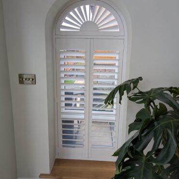 Hardwood Arched Shutter in White With Sunburst fitted in Chester