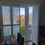 Harris Hardwood Tracked Shutter over French Doors in Buckley North Wales