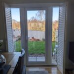 Harris Hardwood Tracked Shutter over French Doors in Buckley North Wales