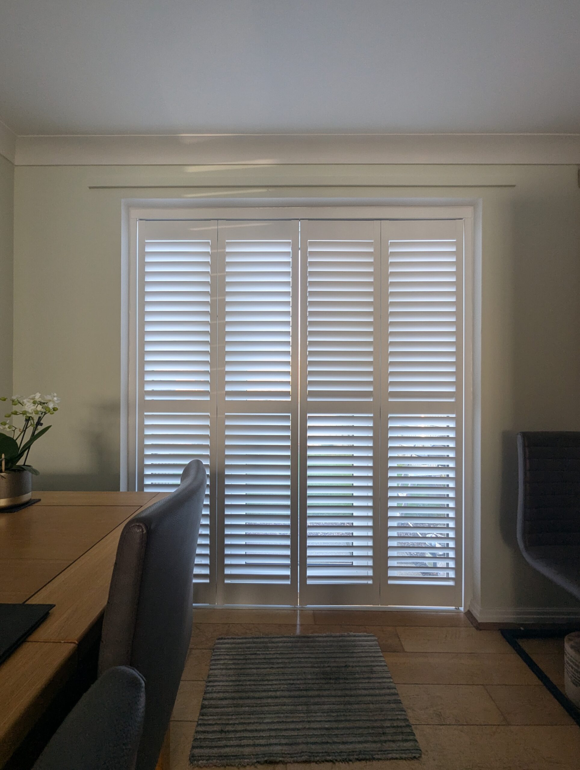 Harris Hardwood Tracked Shutter over French Doors in Buckley North Wales