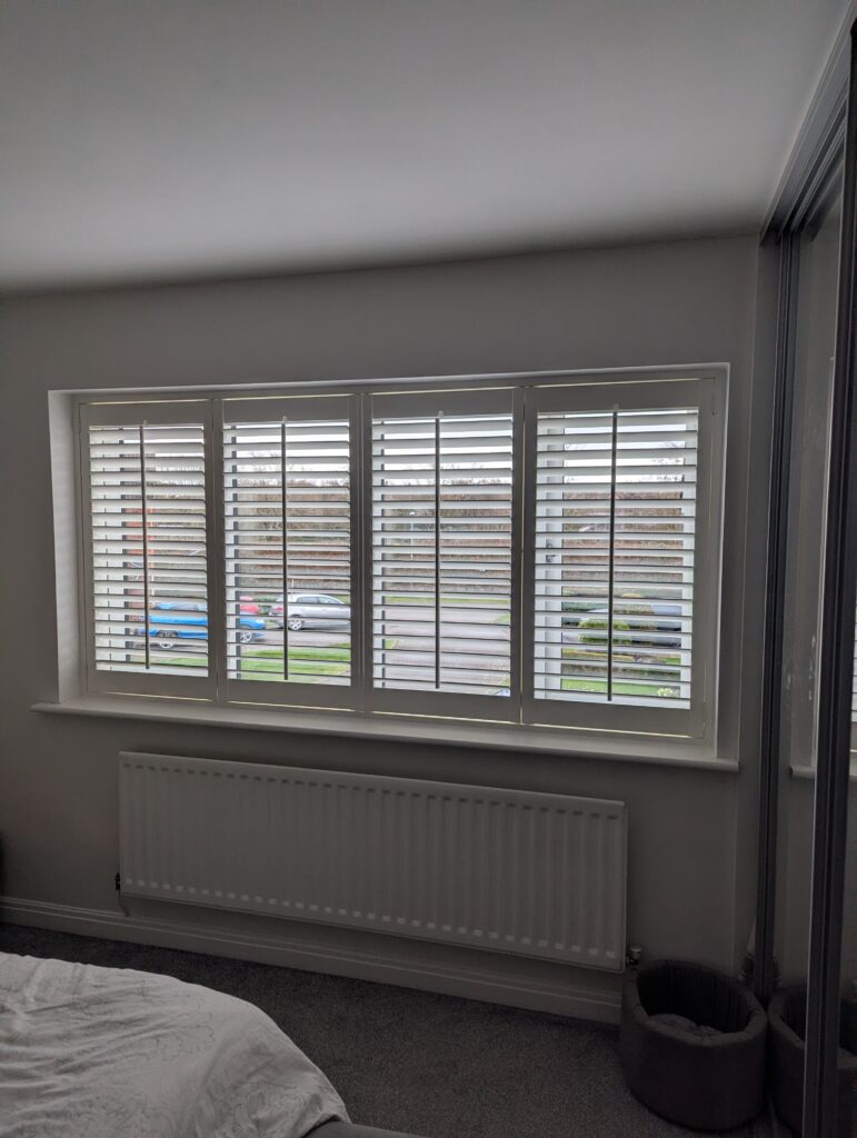 Arran mdf shutter in silk white with central tilt rods installed in Northwich