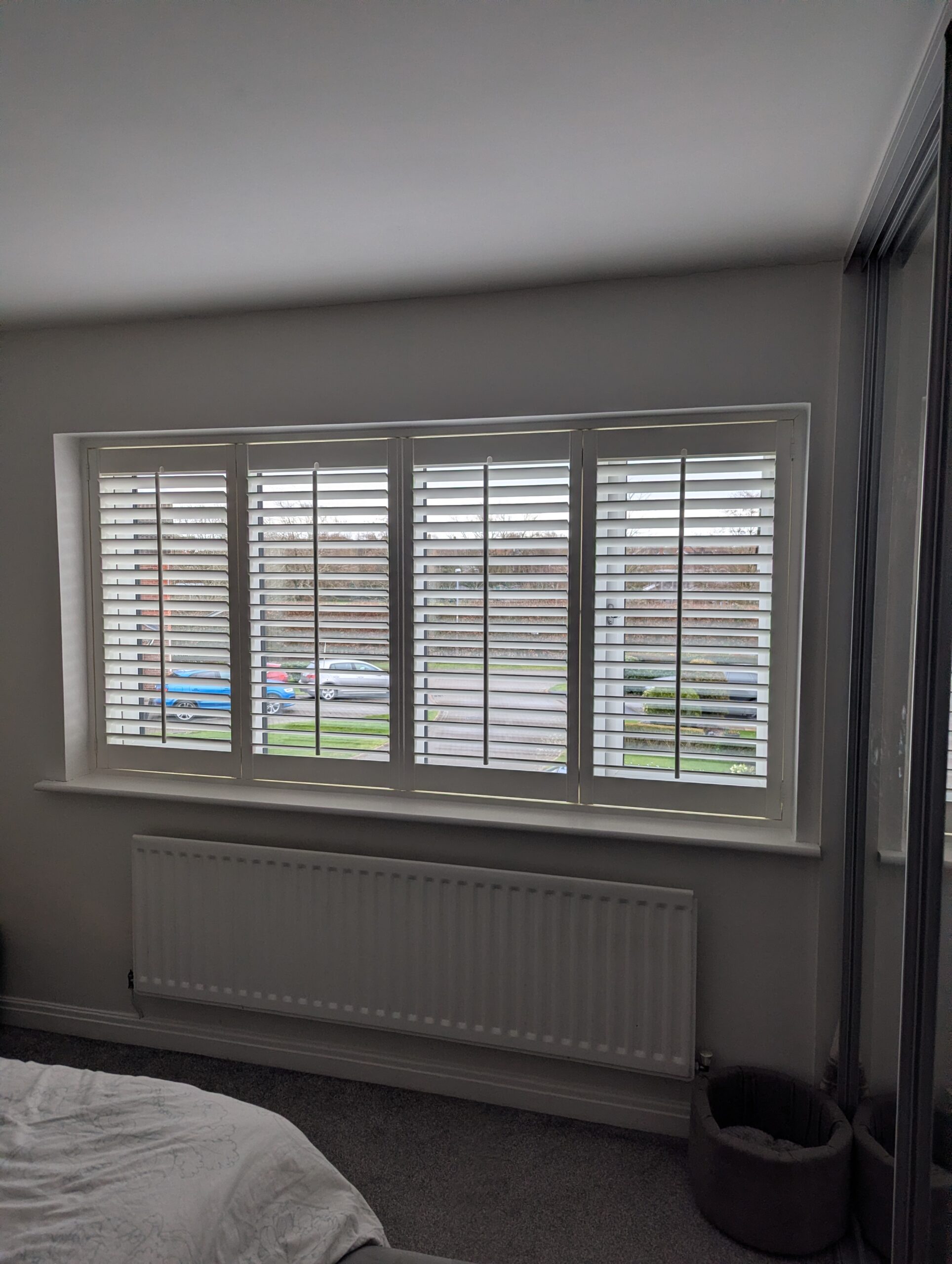 Arran mdf shutter in silk white with central tilt rods installed in Northwich