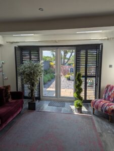 Anthracite Hardwood Shutters Fitted On A Track Over Bi Fold Doors in Wilmslow (2)