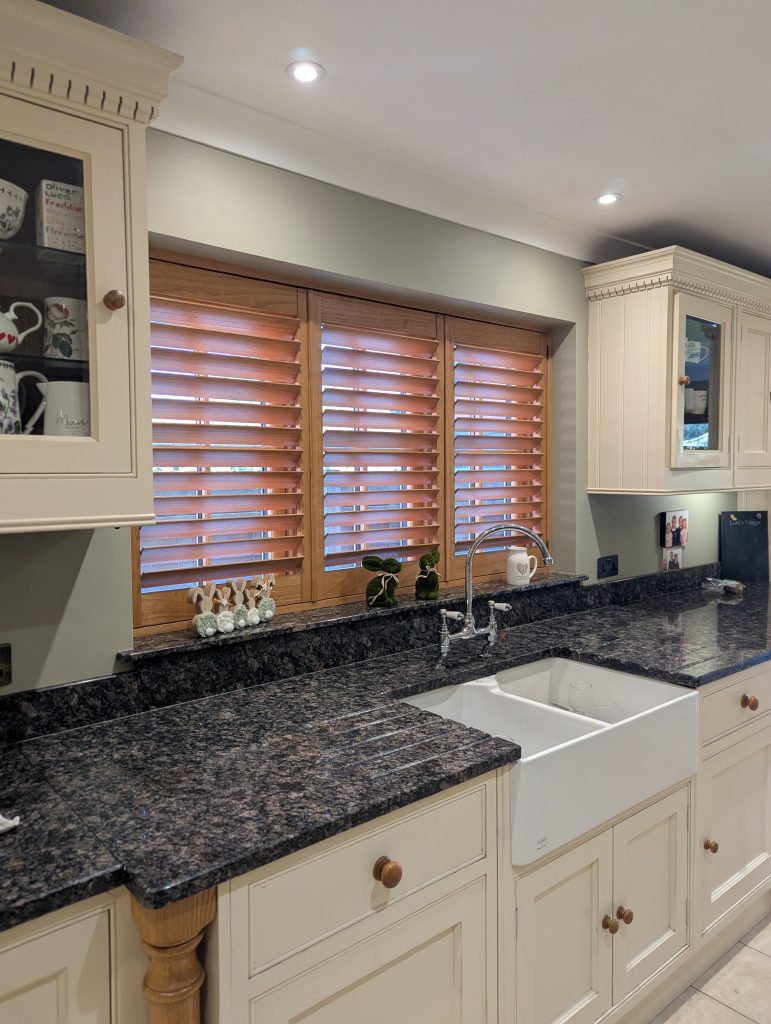 Oak Stain Hardwood Shutters installed in Widnes