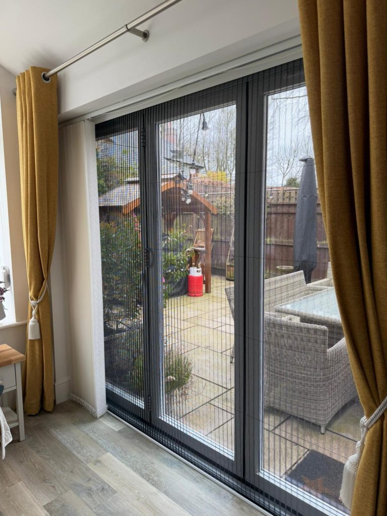 Pleated fly screen over bi fold doors chester (2)